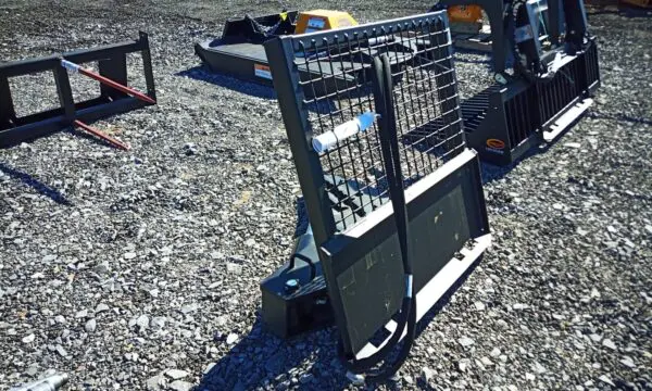 Black metal skid steer attachment with mesh.