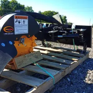 Black and yellow stump grinder on pallet.