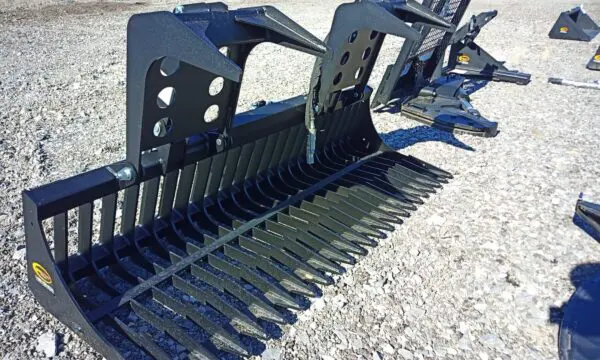 Black metal grapple attachment for a skid steer.