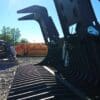 Black excavator bucket with teeth.