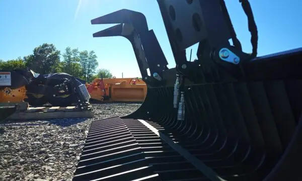 Black excavator bucket with teeth.