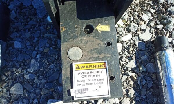 Warning sign: Keep 10 feet away from loader.