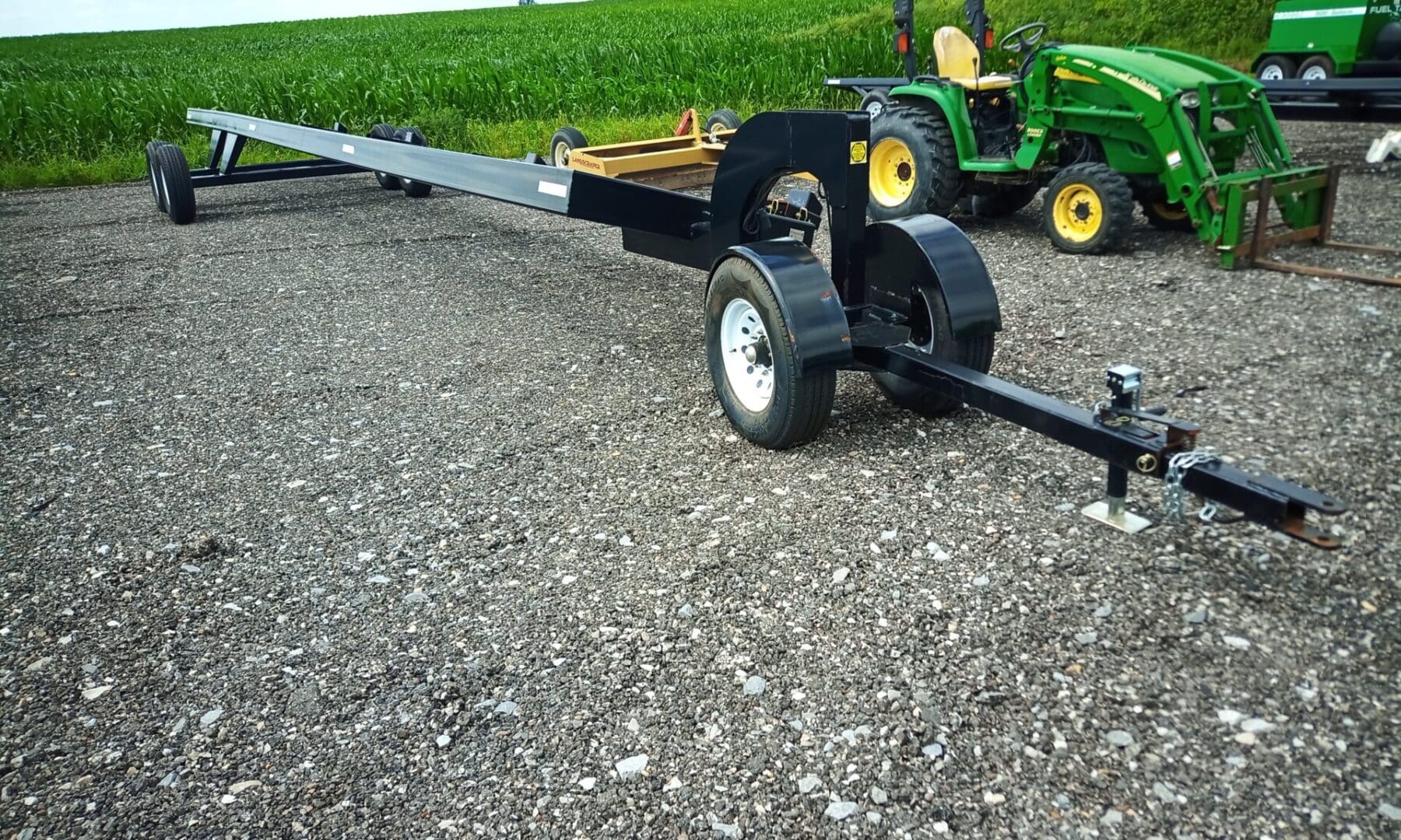 Black trailer hitch attached to tractor.