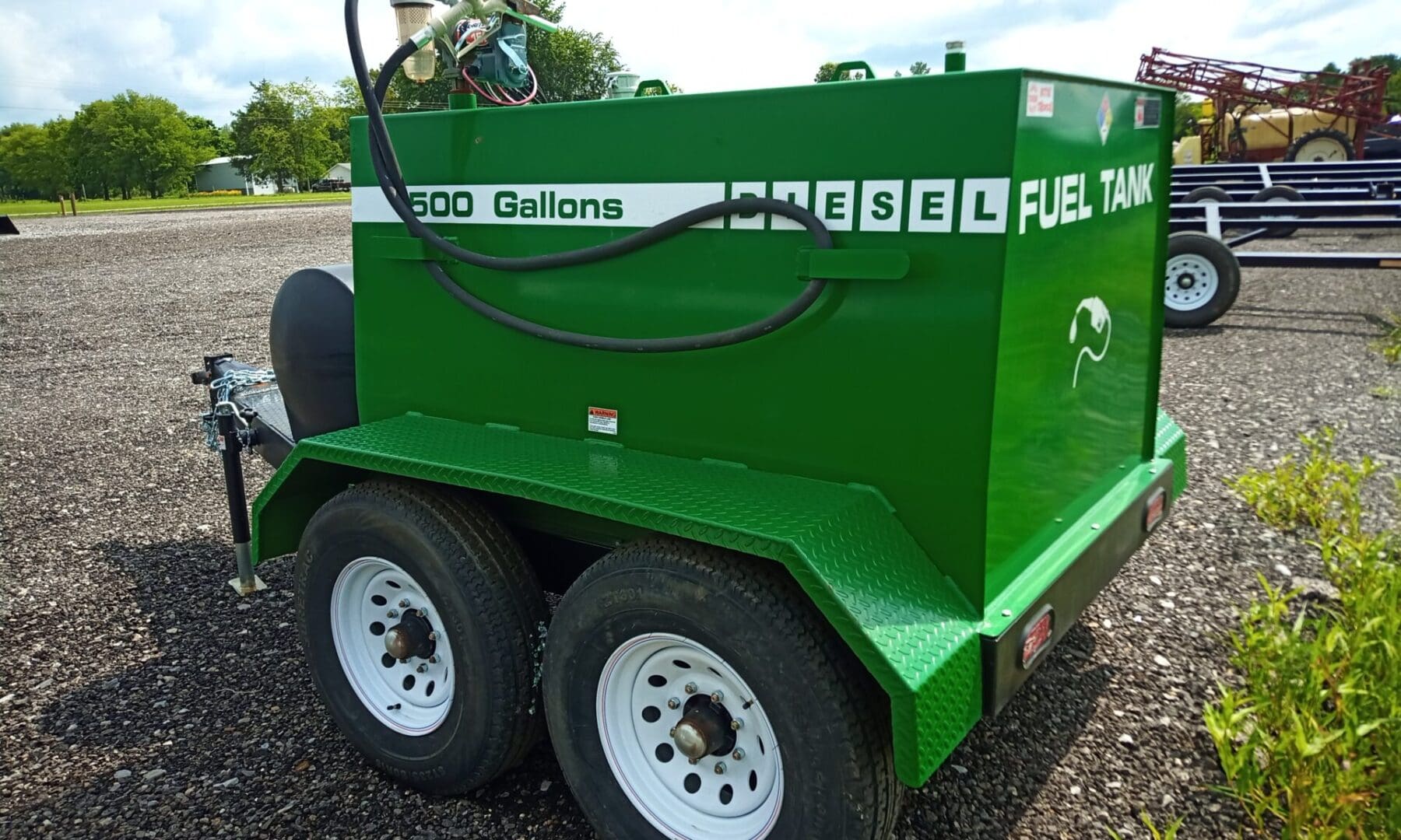 Green 500-gallon diesel fuel tank trailer.