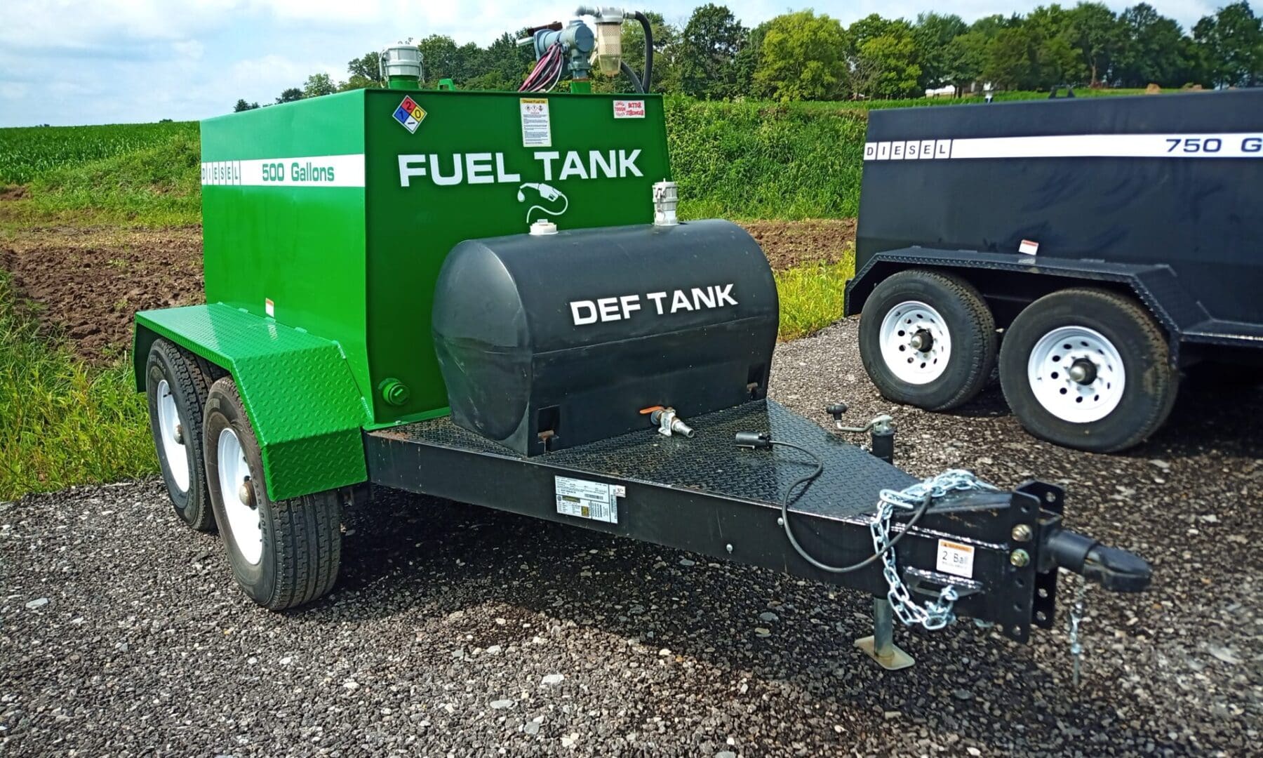 Green and black fuel and DEF tank trailer.