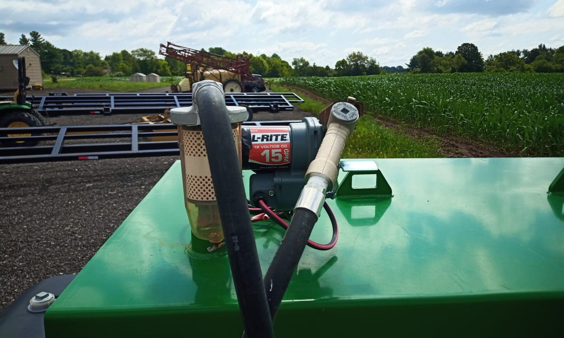 Green fuel tank with a pump and filter.