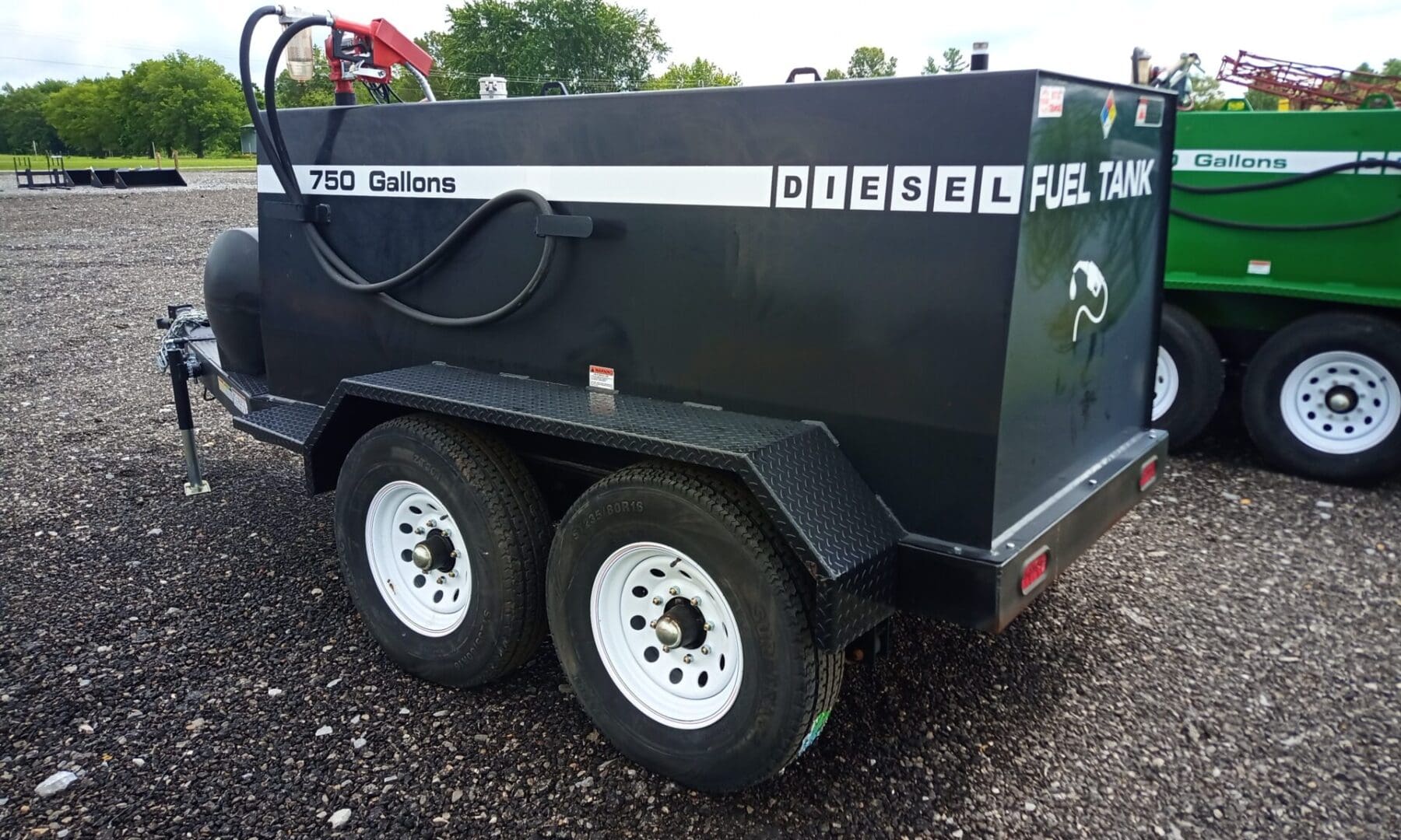 Black 750-gallon diesel fuel tank trailer.