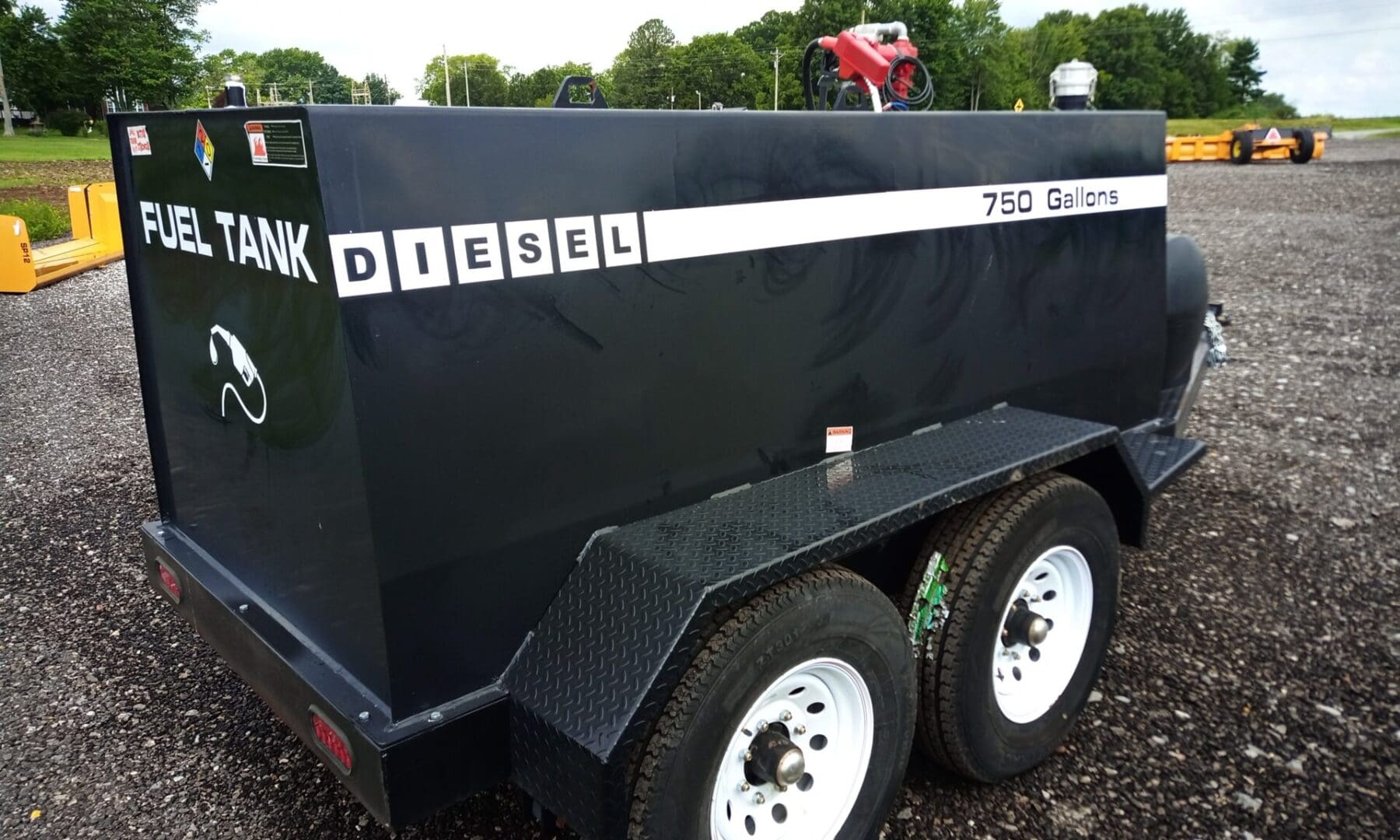 Black diesel fuel tank trailer 750 gallons.