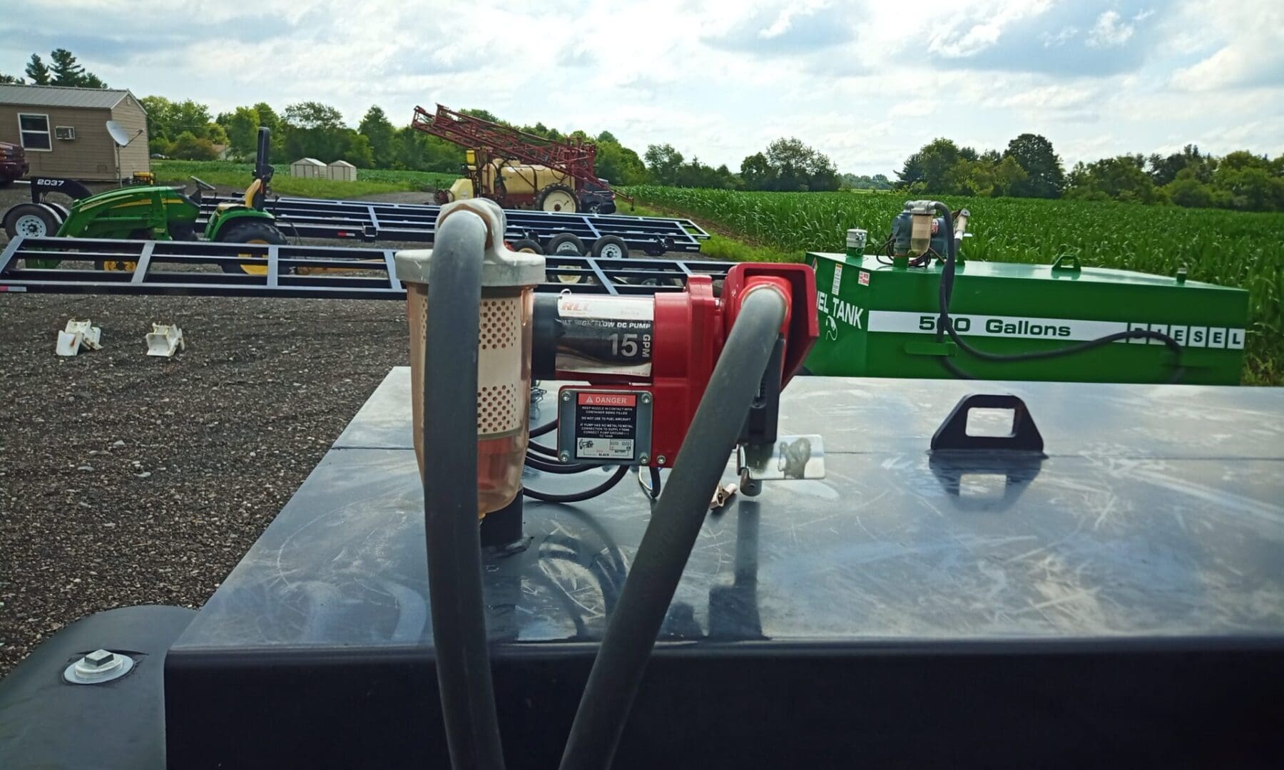 Fuel transfer system with pump and hoses.