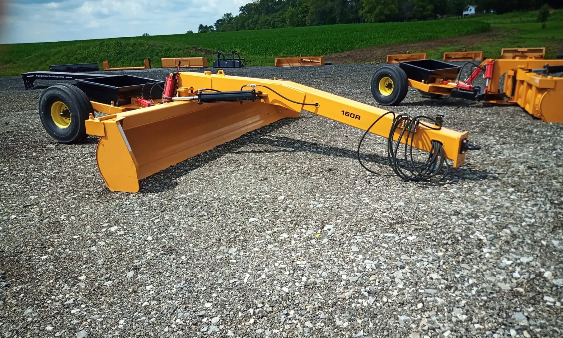 Yellow grader with a single tire.