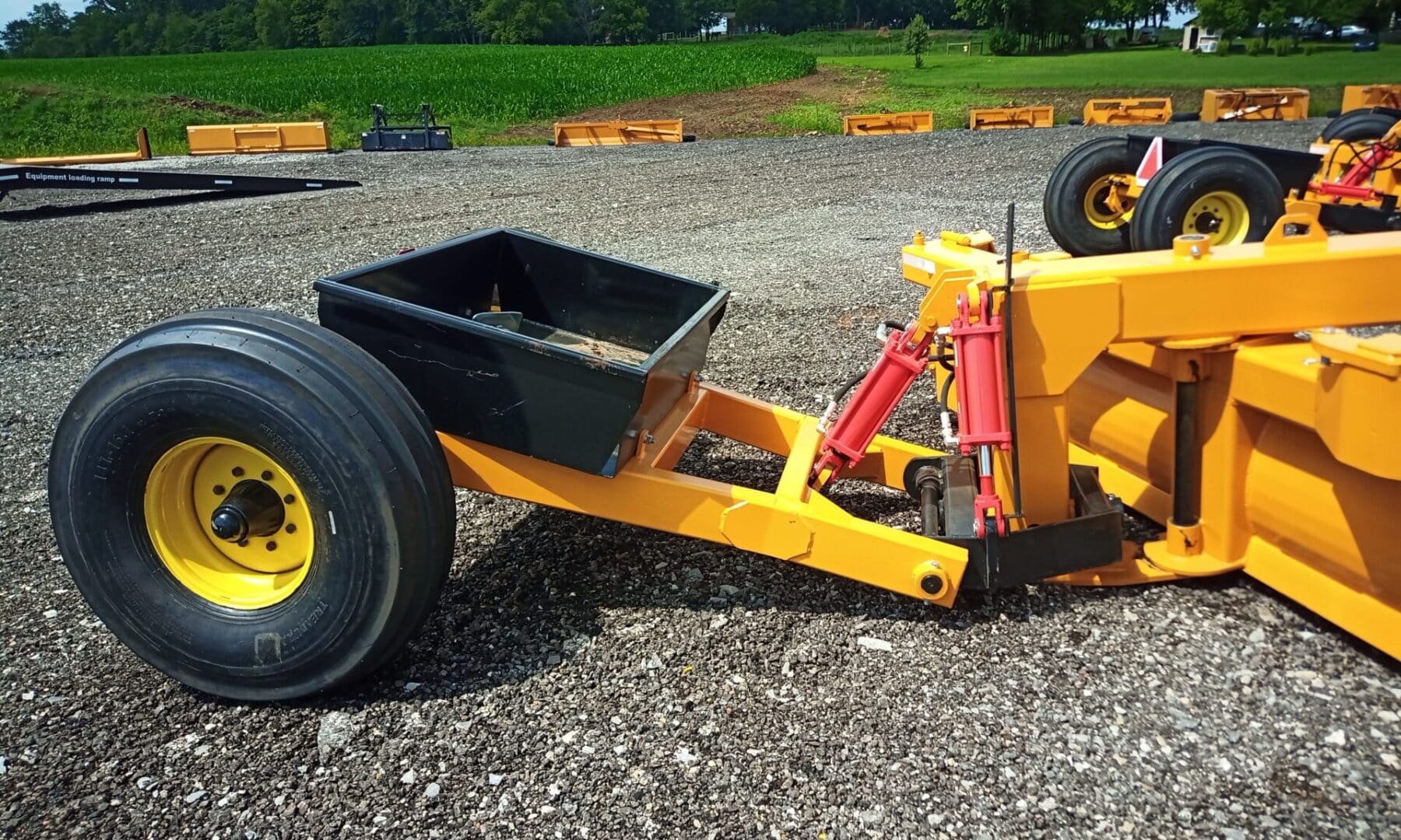 Yellow tractor with large back tire.