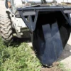 Here's an alt tag for the image: > Skid steer with trenching bucket.
