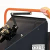 Hand adjusting feed roller direction.
