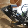 Sand being moved by a skid steer.
