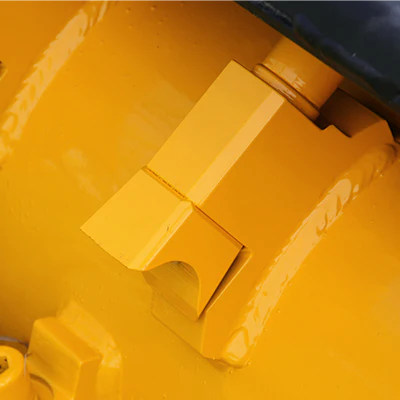 Yellow machinery part detail closeup.