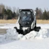 Snow removal with a Bobcat skid-steer.