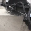 Road milling machine cutting asphalt.