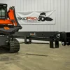 Skid steer with black attachment.