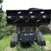 Tracked mulching machine in field.