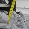 Measuring 3D-printed gray components.