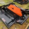 Skid steer rotary cutter attachment.