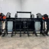 Black grapple skid steer attachment.