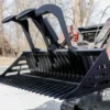 Here's an alt tag for the image: Triple-claw grapple skid steer bucket.