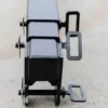 Here's a short alt tag for the image: Black metal beam with securing clamps.