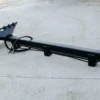 Here's an alt tag for the image: Black hydraulic grapple for tractor.