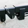 Here's an alt tag for the image: Black metal hydraulic lift mechanism.