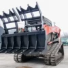 Here's an alt tag for the image: `Tracked skid steer with grapple attachment`